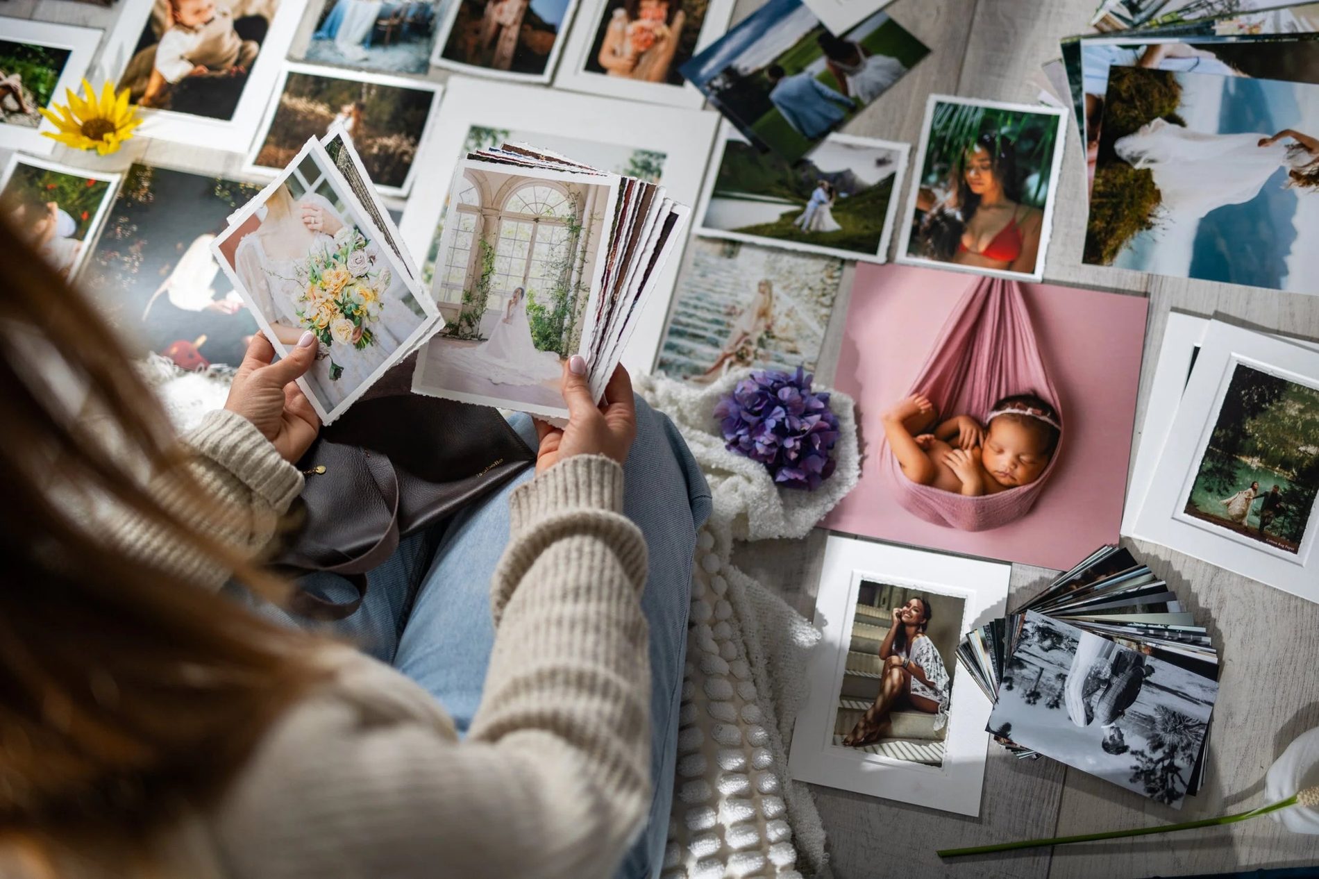 Photographer choosing prints spread out on the floor