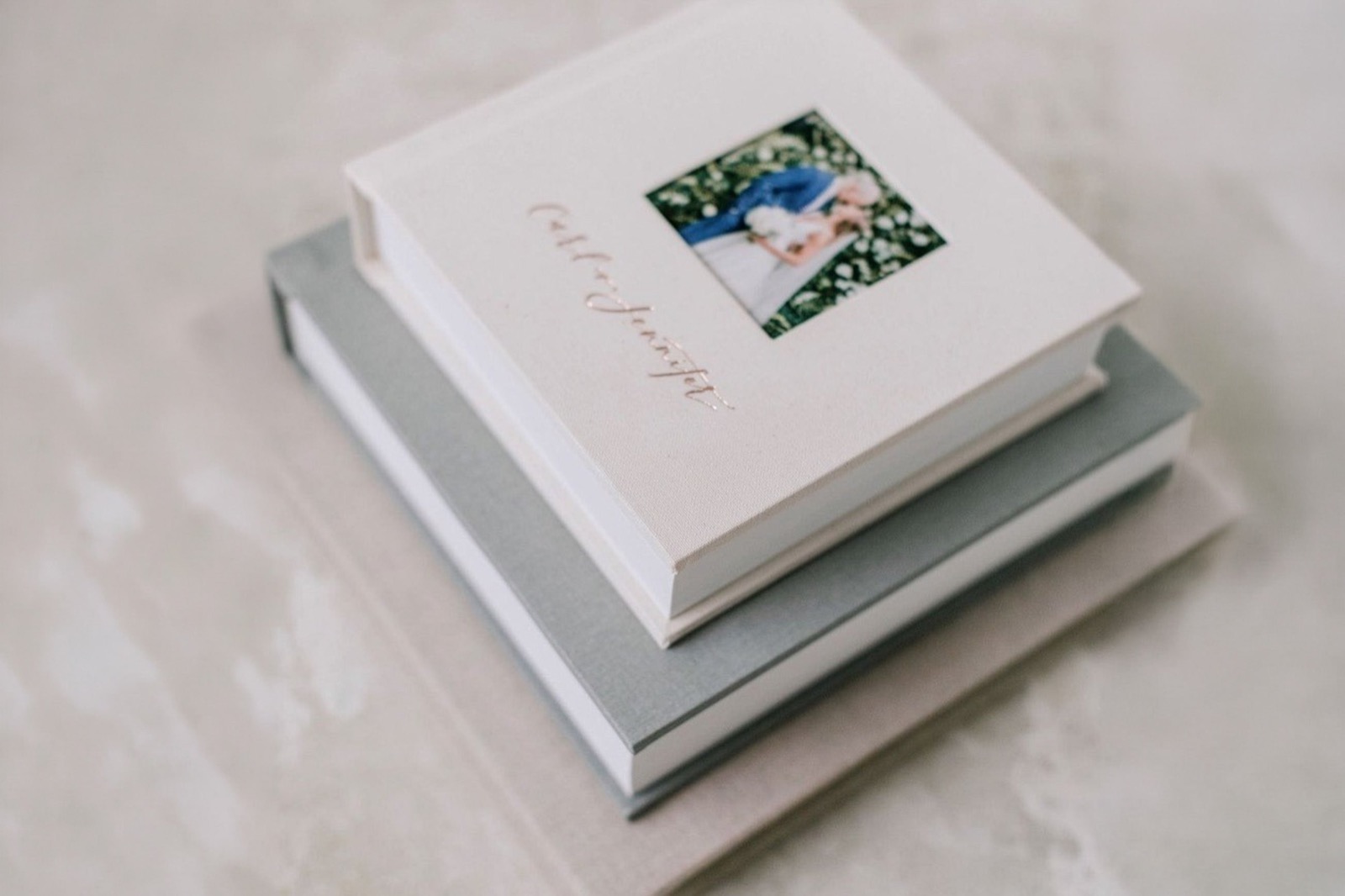 Personalized album covers with a photograph window and lettering