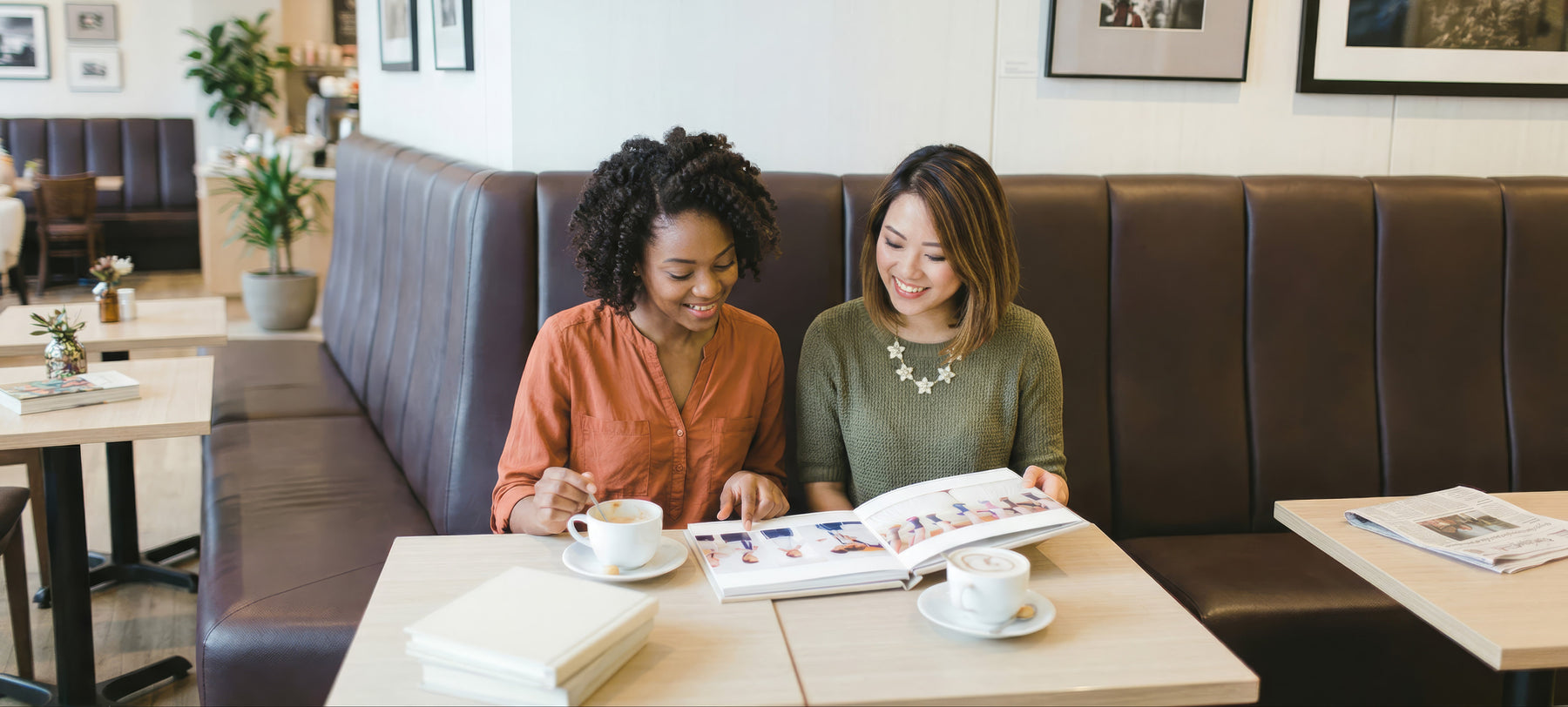 A photographer sharing a book with a client