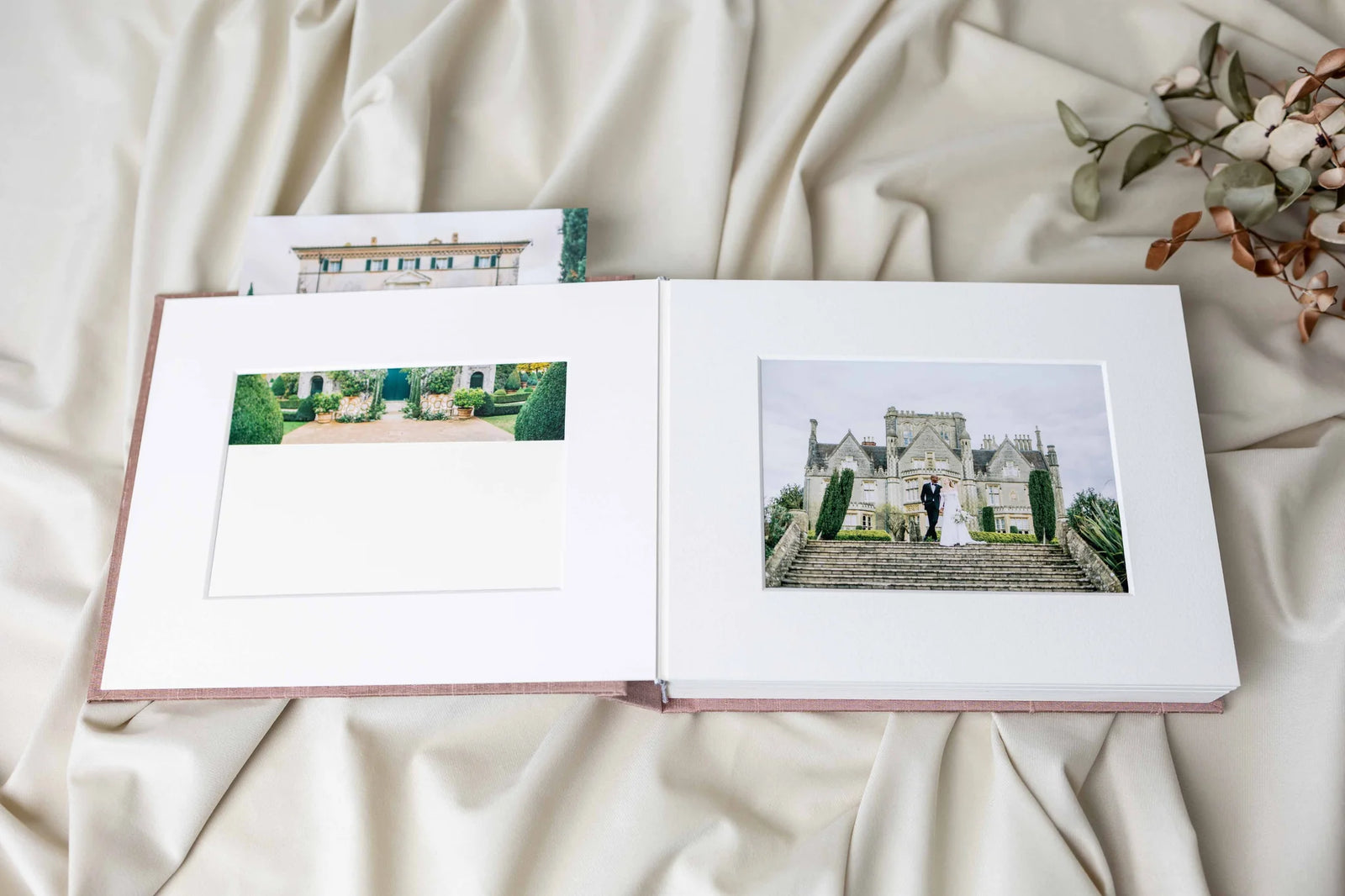 A photographic print sliding into the top of a Matted Album page.