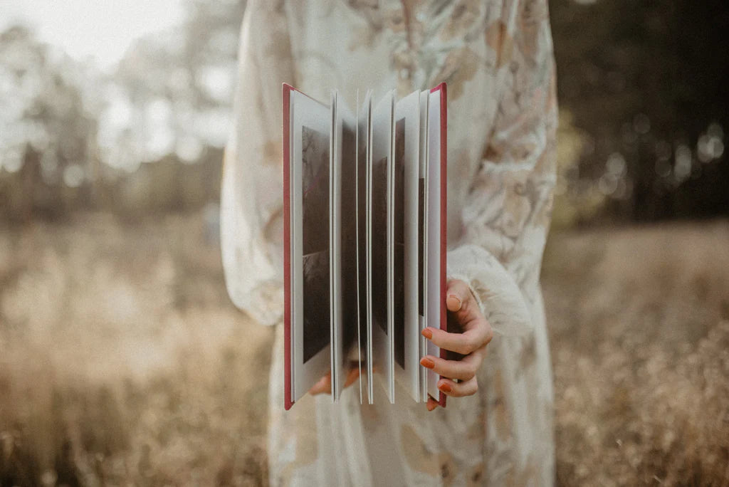 An album held open to show its thinner pages